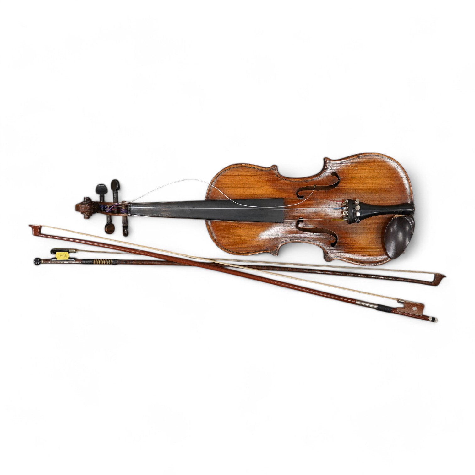 A late 19th century German violin, body 35cm long, and two bows. Condition - poor to fair.